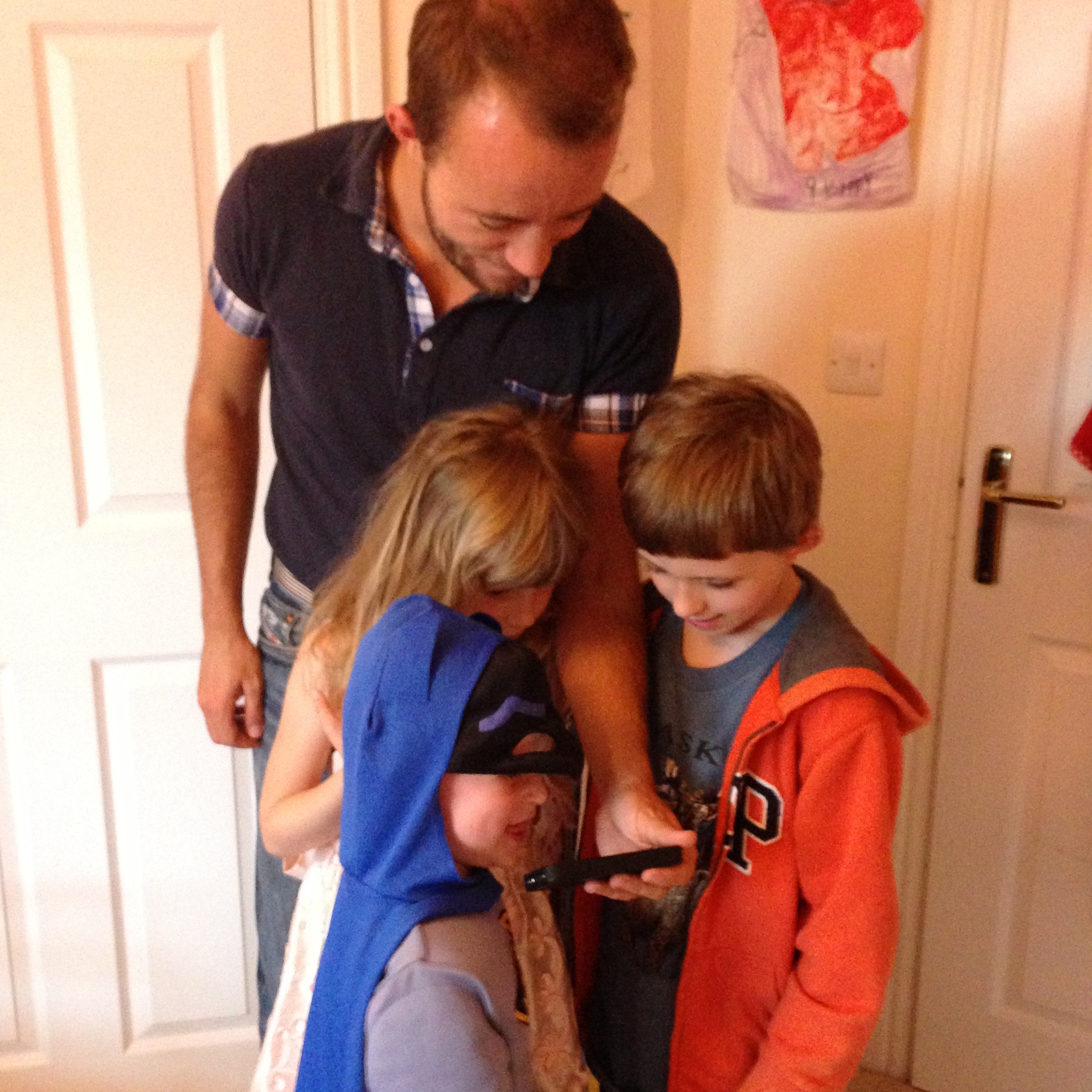 Reviewing a film clip of our intensive "training" - with mini-Batman (aka my younger nephew), my niece and my older nephew!